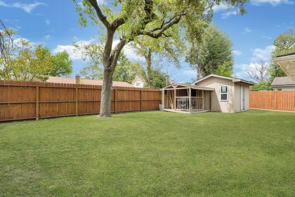 4518 Seneca Street Pasadena, TX 77504 - Photo 24 of 26 a view of a house with a backyard