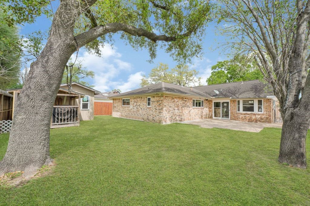 4518 Seneca Street Pasadena, TX 77504 - Photo 25 of 26 a front view of a house with a garden