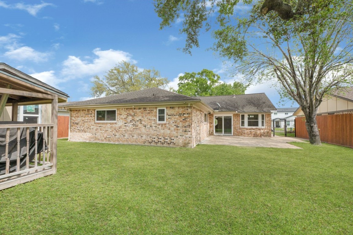 4518 Seneca Street Pasadena, TX 77504 - Photo 26 of 26 a front view of a house with a garden