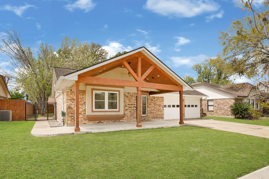 4518 Seneca Street Pasadena, TX 77504 - Photo 3 of 26 a front view of a house with a yard