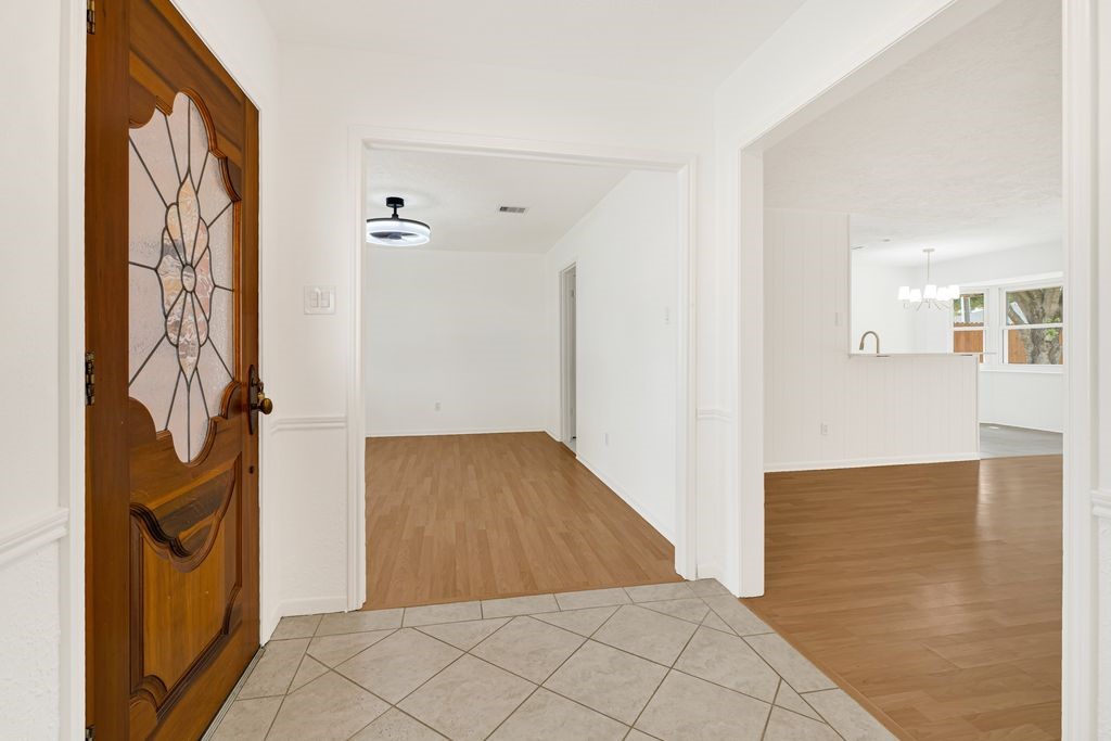 4518 Seneca Street Pasadena, TX 77504 - Photo 6 of 26 a view of a hallway with wooden floor and entryway