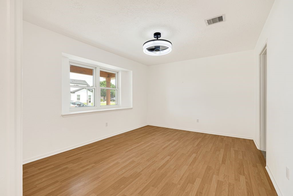 4518 Seneca Street Pasadena, TX 77504 - Photo 7 of 26 an empty room with a window