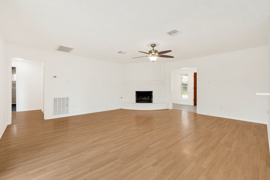 4518 Seneca Street Pasadena, TX 77504 - Photo 9 of 26 a view of an empty room with a chandelier fan