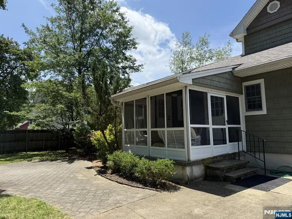 a house with trees in the background