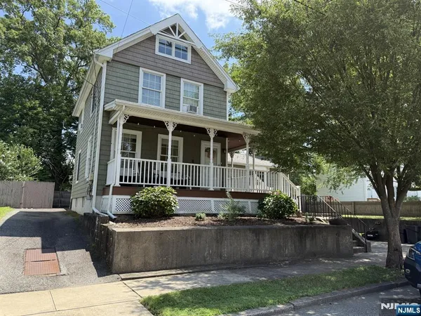 a front view of a house with garage