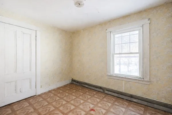 an empty room with windows