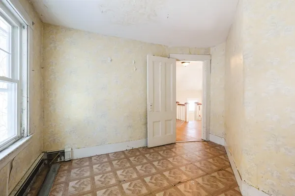 a view of an empty room and window