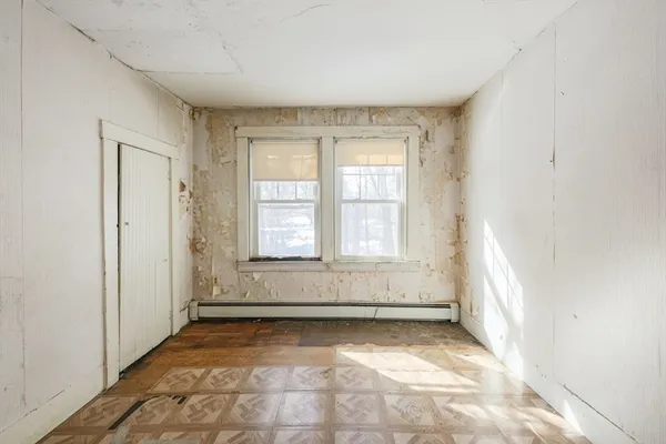 an empty room with windows