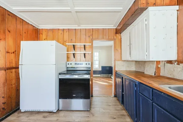 a kitchen with stainless steel appliances granite countertop a refrigerator sink and cabinets