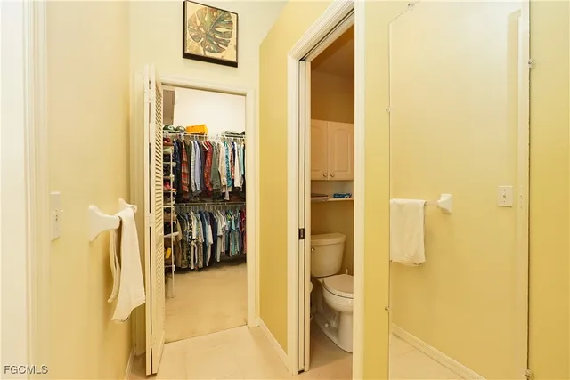 a view of a walk in closet and bathroom
