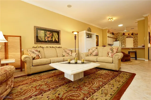 a living room with furniture and a rug