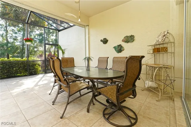a view of an outdoor dining space with a table and chairs