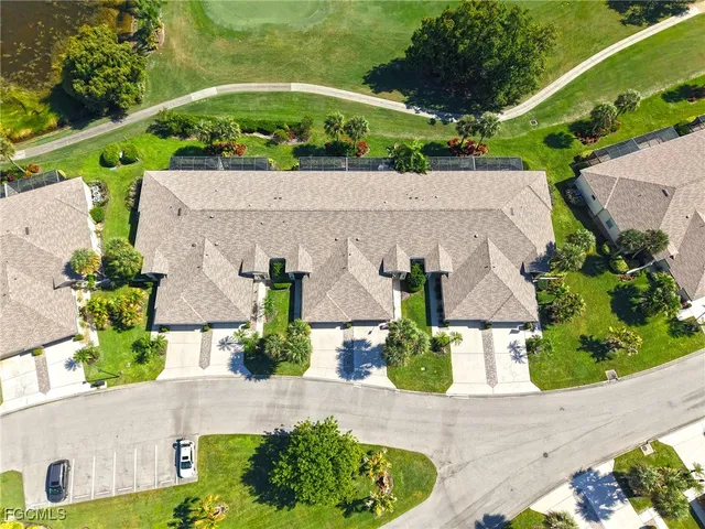 an aerial view of a house with a garden and lots of trees