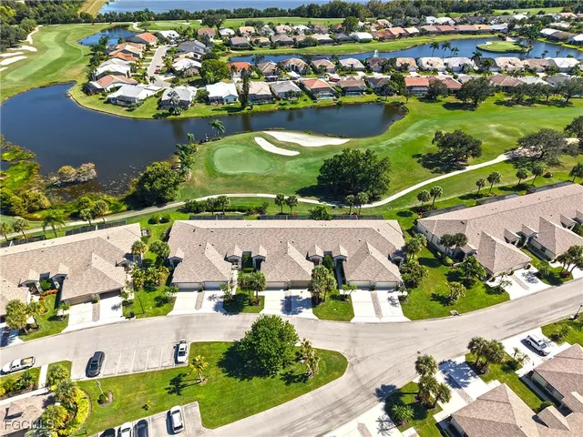 an aerial view of residential houses with outdoor space and street view
