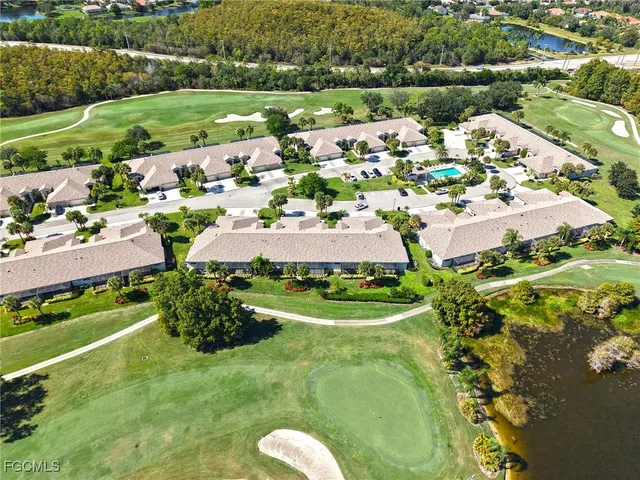 an aerial view of a house with yard swimming pool and outdoor seating