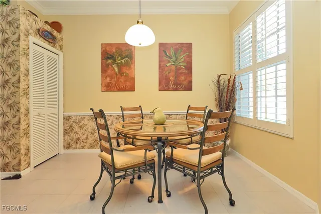 a dining room with furniture and window