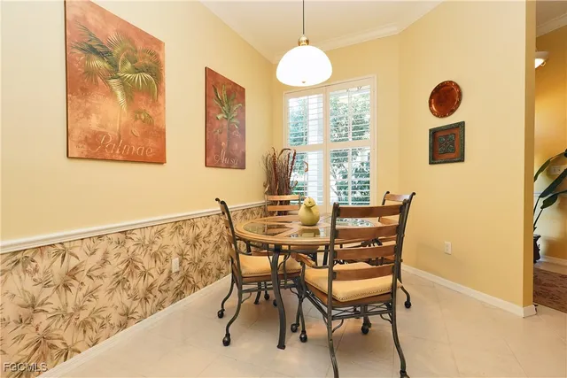 a view of a dining room with furniture and window