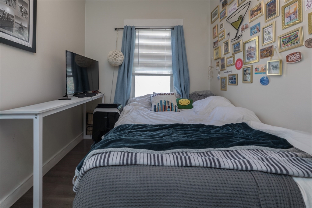100 H Street, Unit 1 Boston, MA 02127 - Photo 9 of 12 a bedroom with a bed and a window