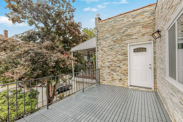 a view of a balcony with wooden floor