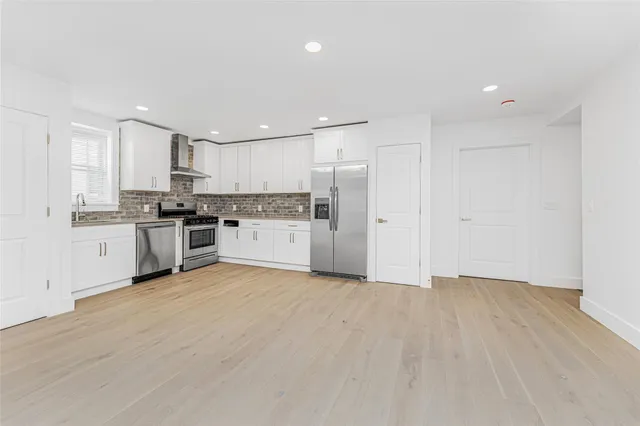 a view of kitchen with wooden floor