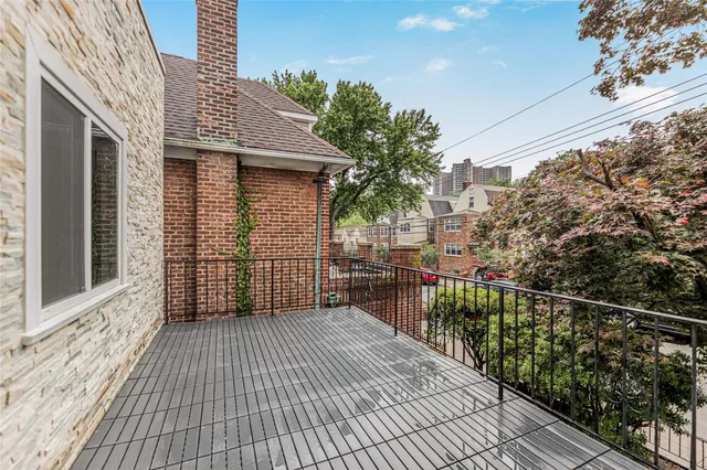 a balcony with wooden floor