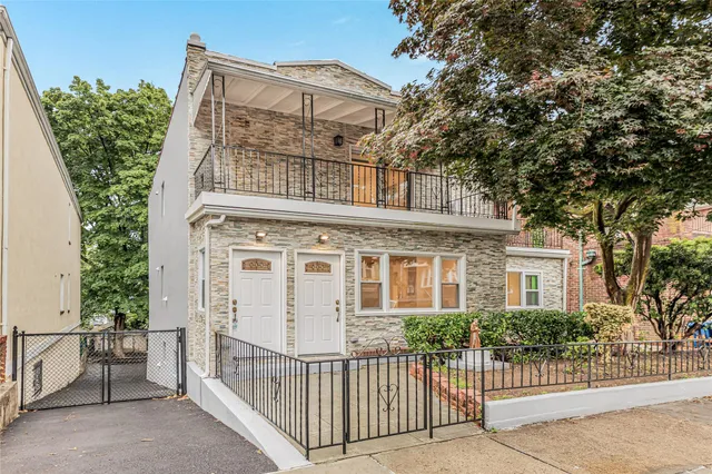 front view of a house with a small yard