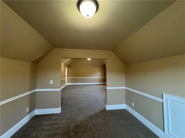 an empty room with a empty space and windows