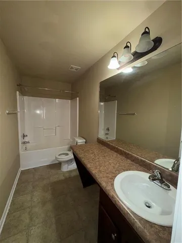 a view of a hallway with wooden shelves