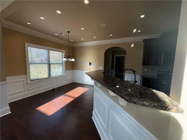 a kitchen with sink and window