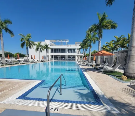 a view of swimming pool with chairs