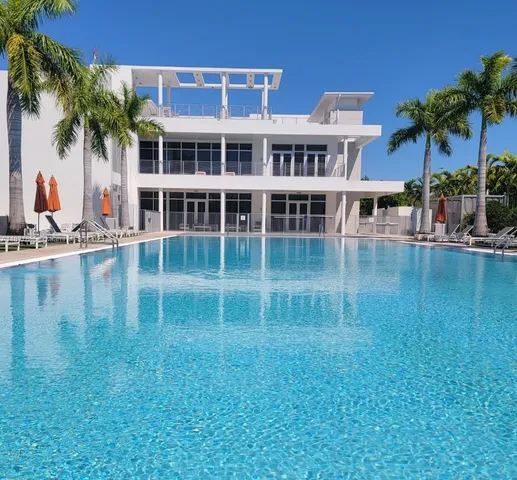 a view of a lake with a building in the background