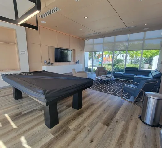 a room with furniture and a flat screen tv