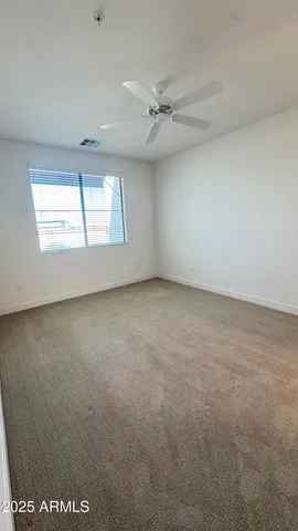 a spacious bathroom with a double vanity sink and a mirror