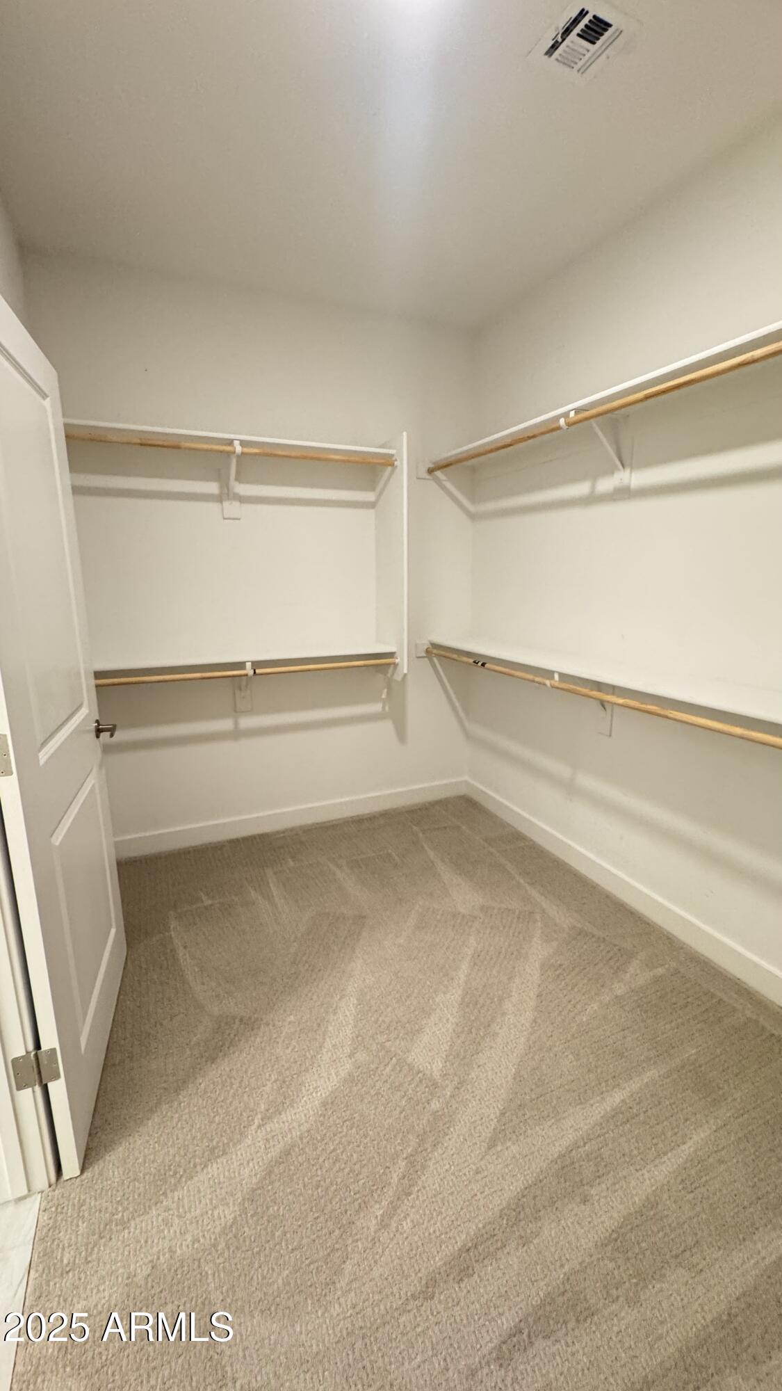 2511 West Queen Creek Road, Unit 377 Chandler, AZ 85248 - Photo 19 of 47 a view of an empty walk in closet