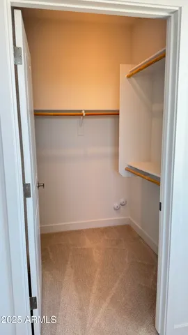 a bathroom with a double vanity sink toilet and shower