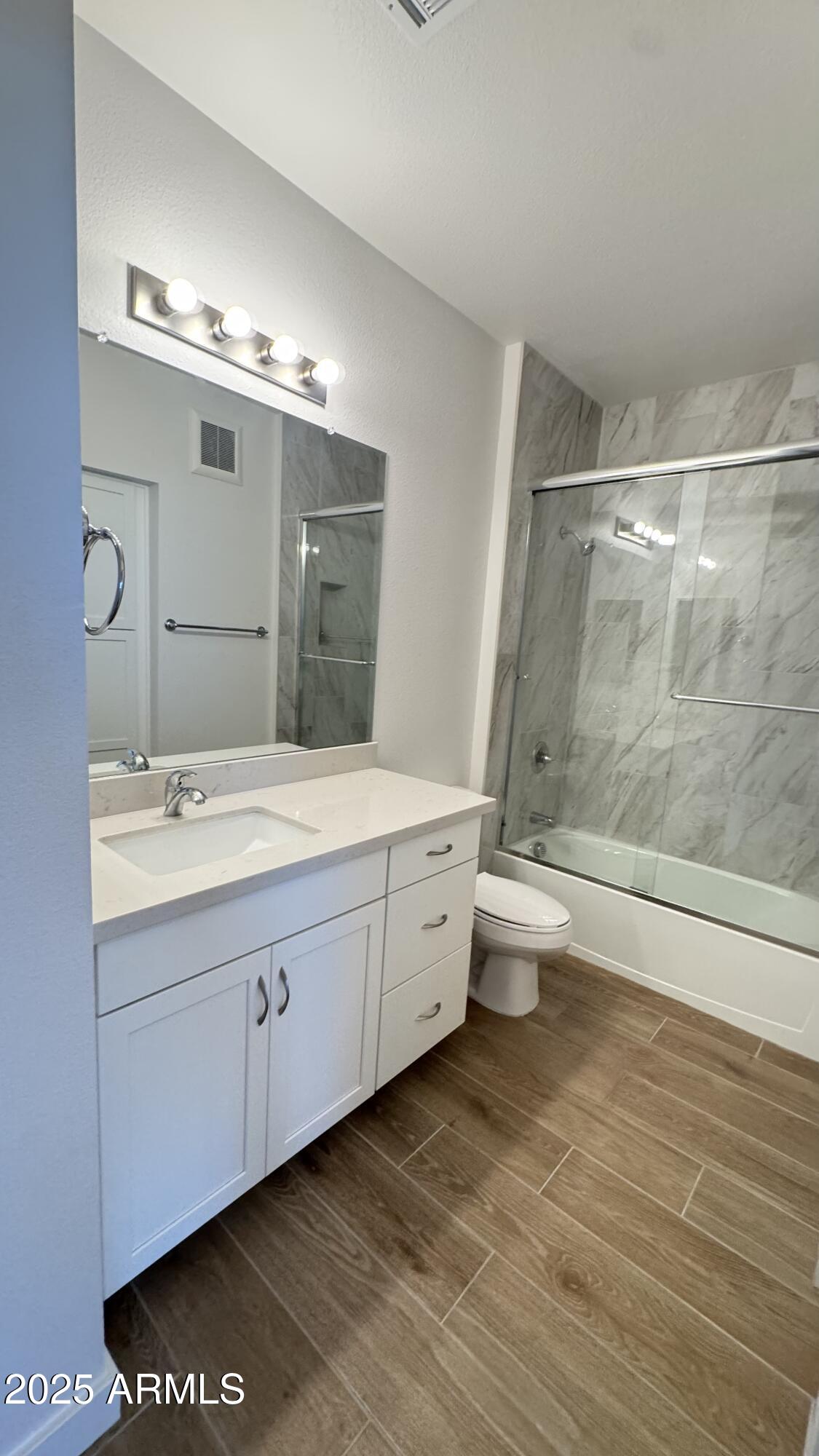 2511 West Queen Creek Road, Unit 377 Chandler, AZ 85248 - Photo 22 of 47 a bathroom with a double vanity sink toilet and shower