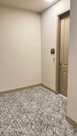 en empty room with a fireplace