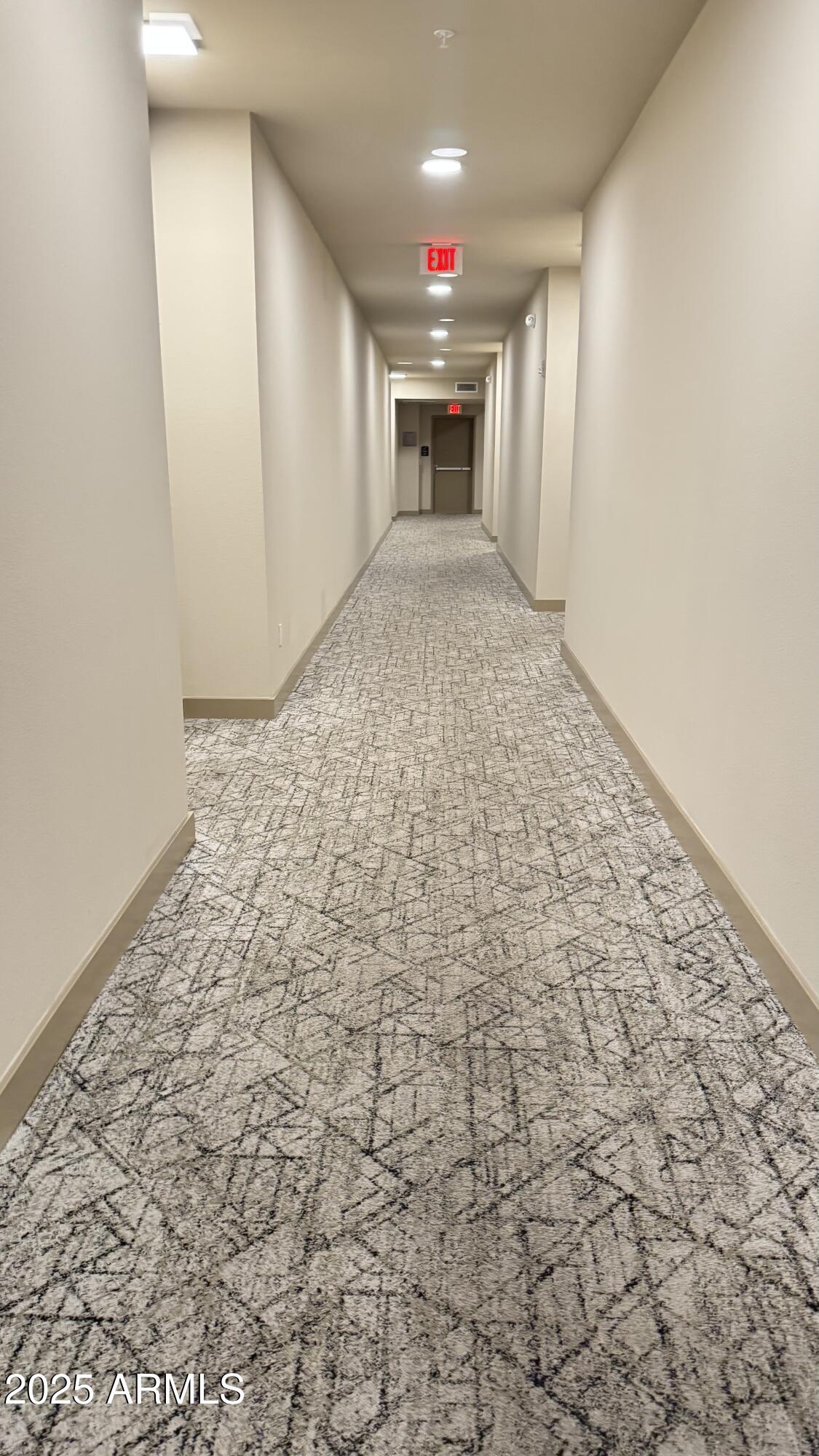2511 West Queen Creek Road, Unit 377 Chandler, AZ 85248 - Photo 30 of 47 en empty room with a fireplace