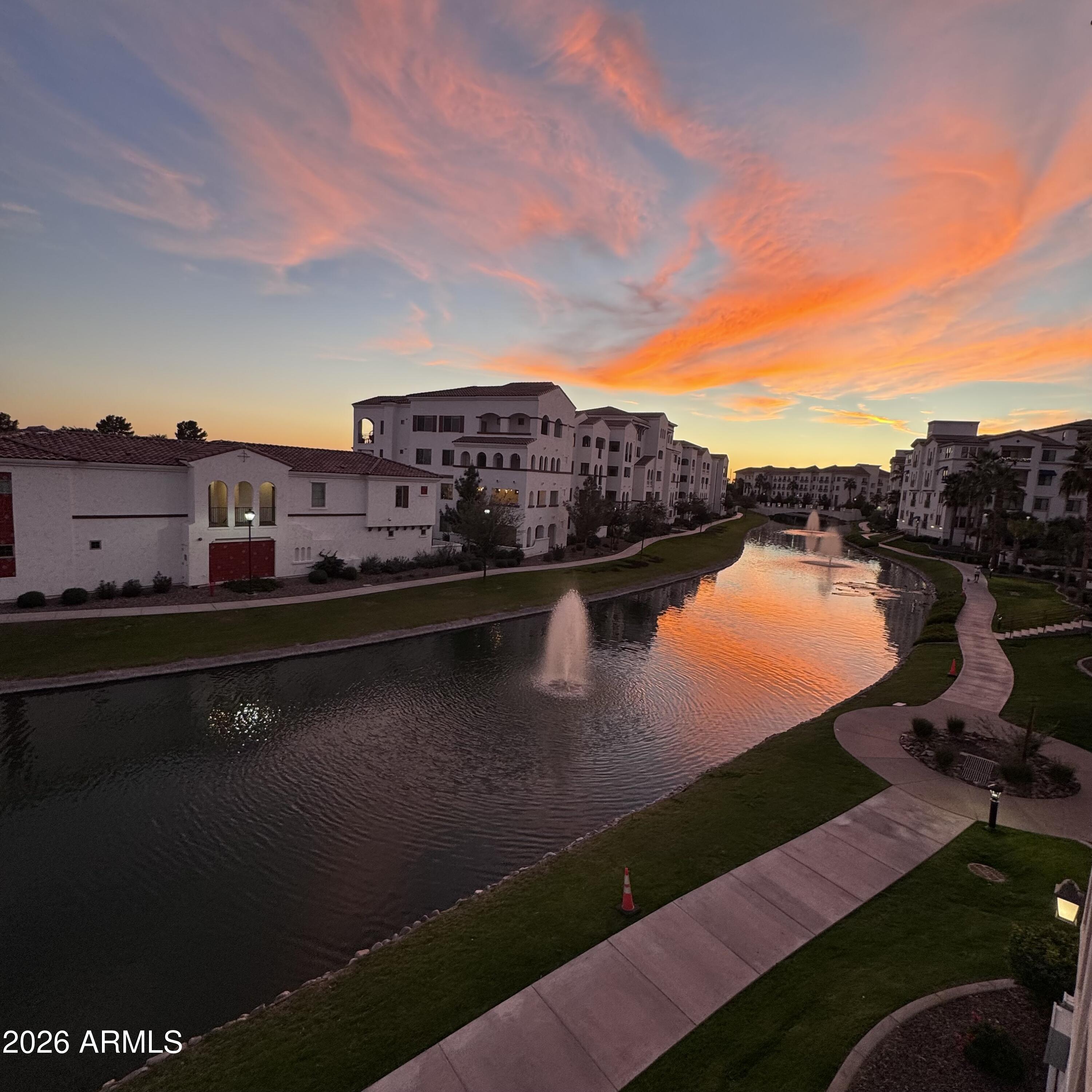 2511 West Queen Creek Road, Unit 377 Chandler, AZ 85248 - Photo 49 of 50 an aerial view of residential houses with outdoor space and lake view