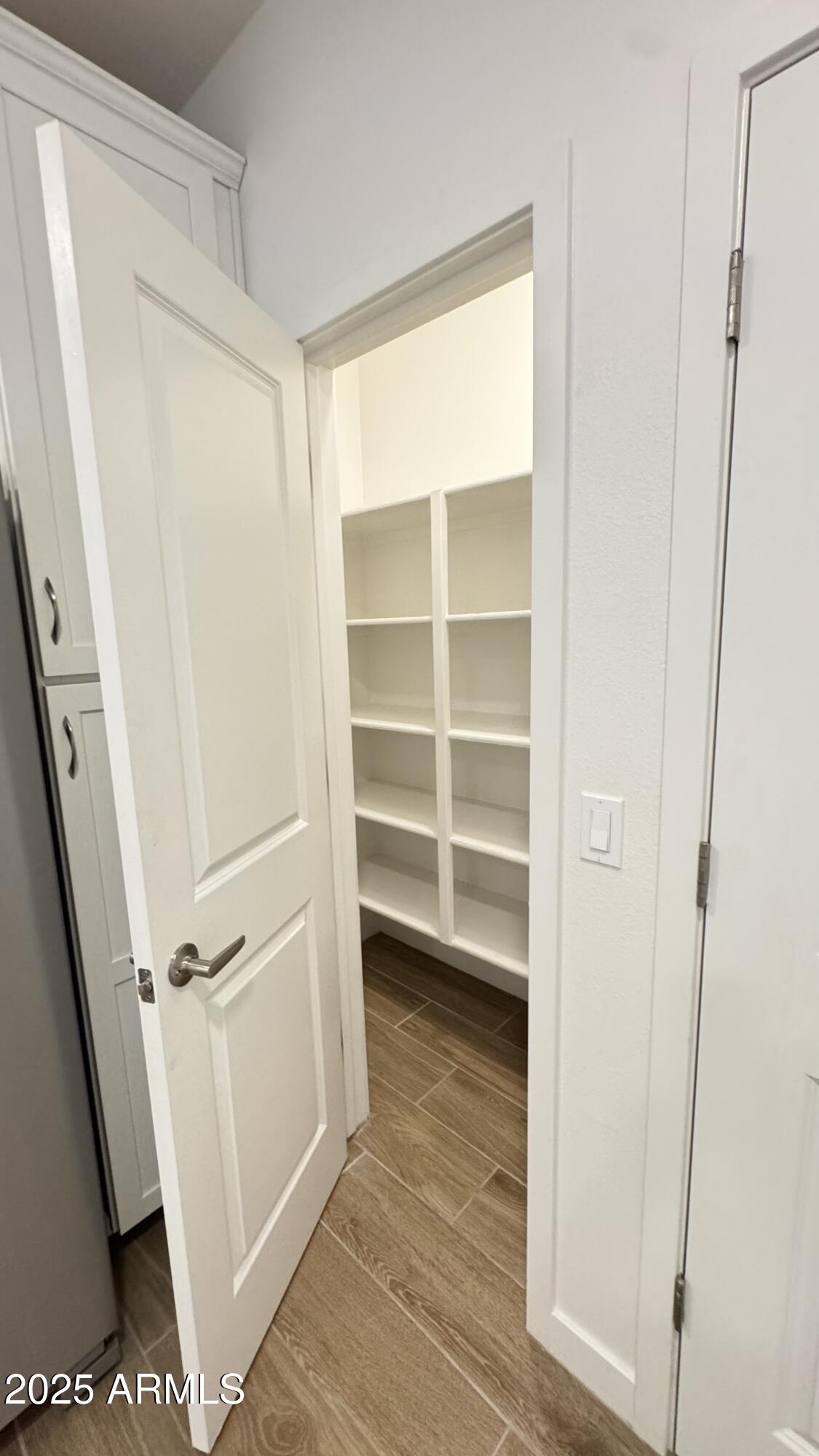 2511 West Queen Creek Road, Unit 377 Chandler, AZ 85248 - Photo 8 of 47 a view of closet area with empty racks