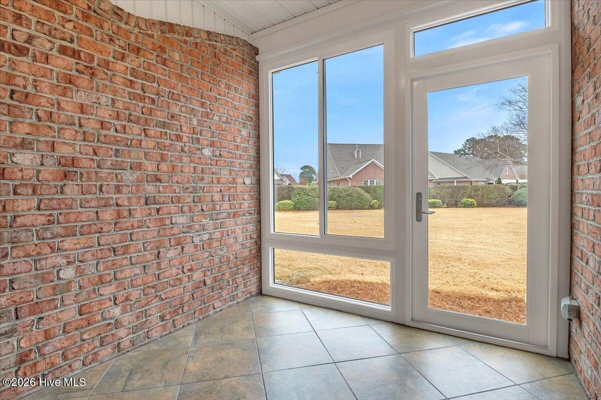 243 Windchime Way Leland, NC 28451 - Photo 19 of 68 Glassed in Sunroom