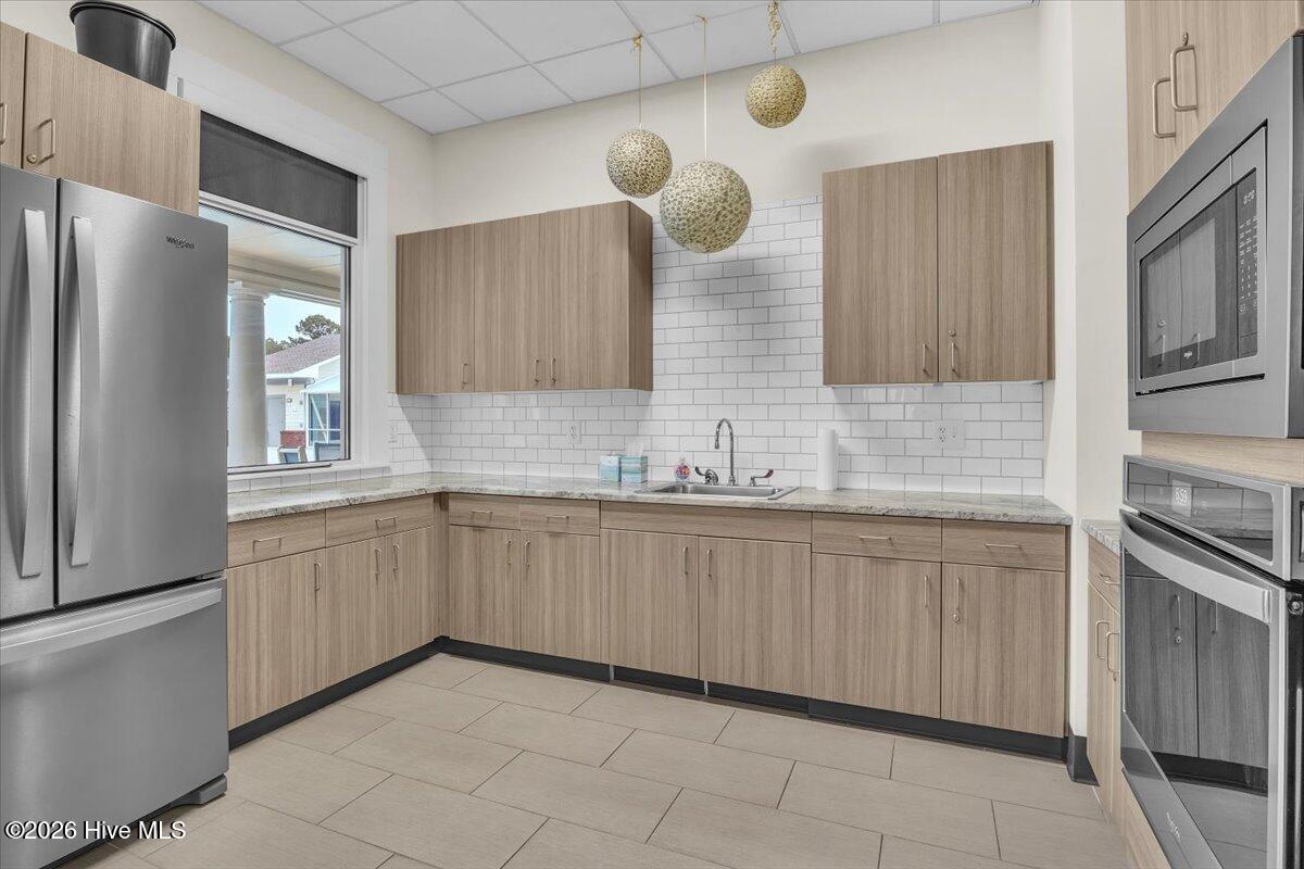 243 Windchime Way Leland, NC 28451 - Photo 59 of 68 Community Kitchen