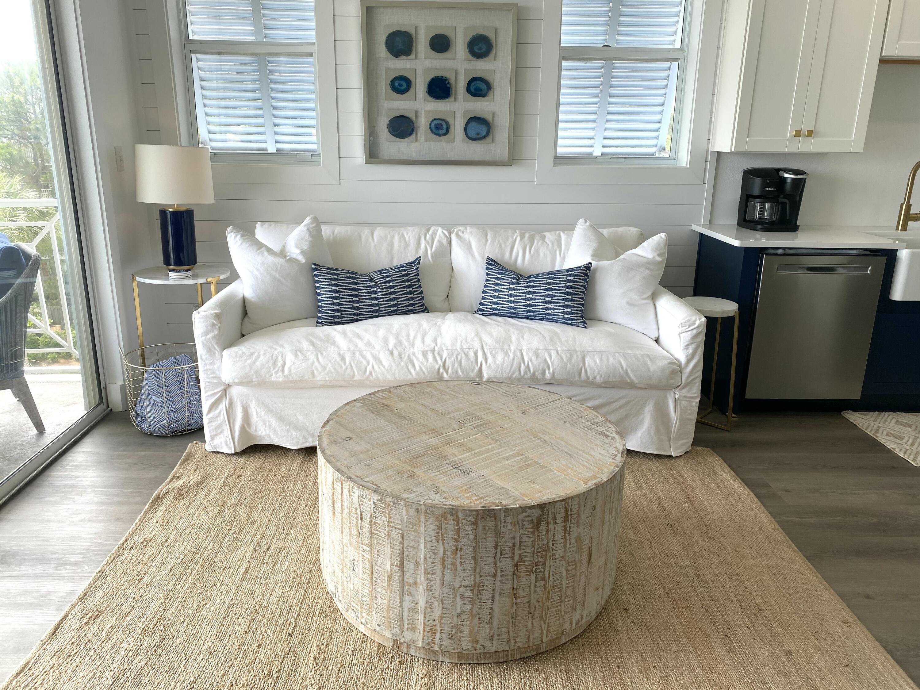 145 Spires Lane, Unit 411 Santa Rosa Beach, FL 32459 - Photo 11 of 44 a living room with a couch and a table