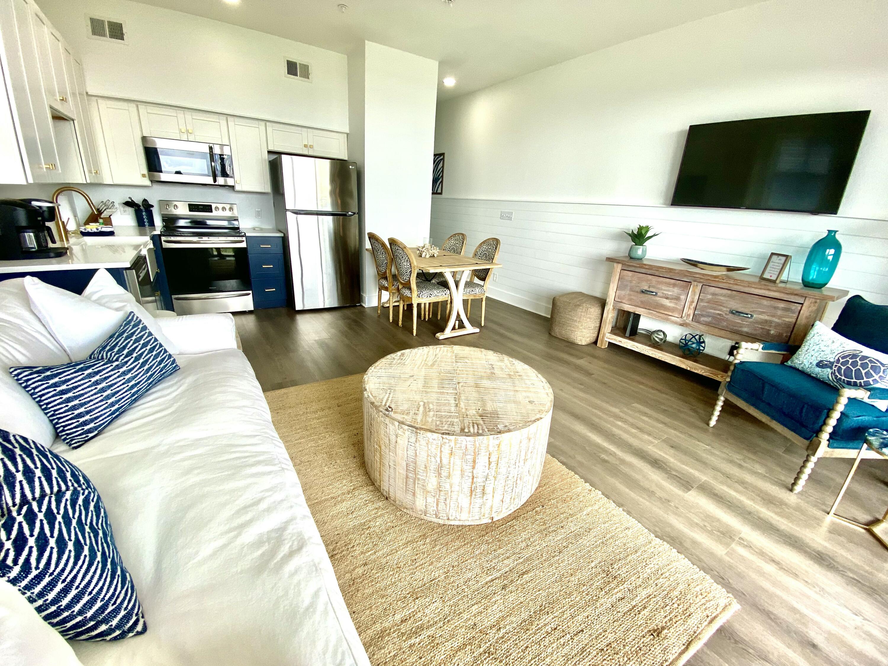 145 Spires Lane, Unit 411 Santa Rosa Beach, FL 32459 - Photo 13 of 44 a living room with furniture and a flat screen tv