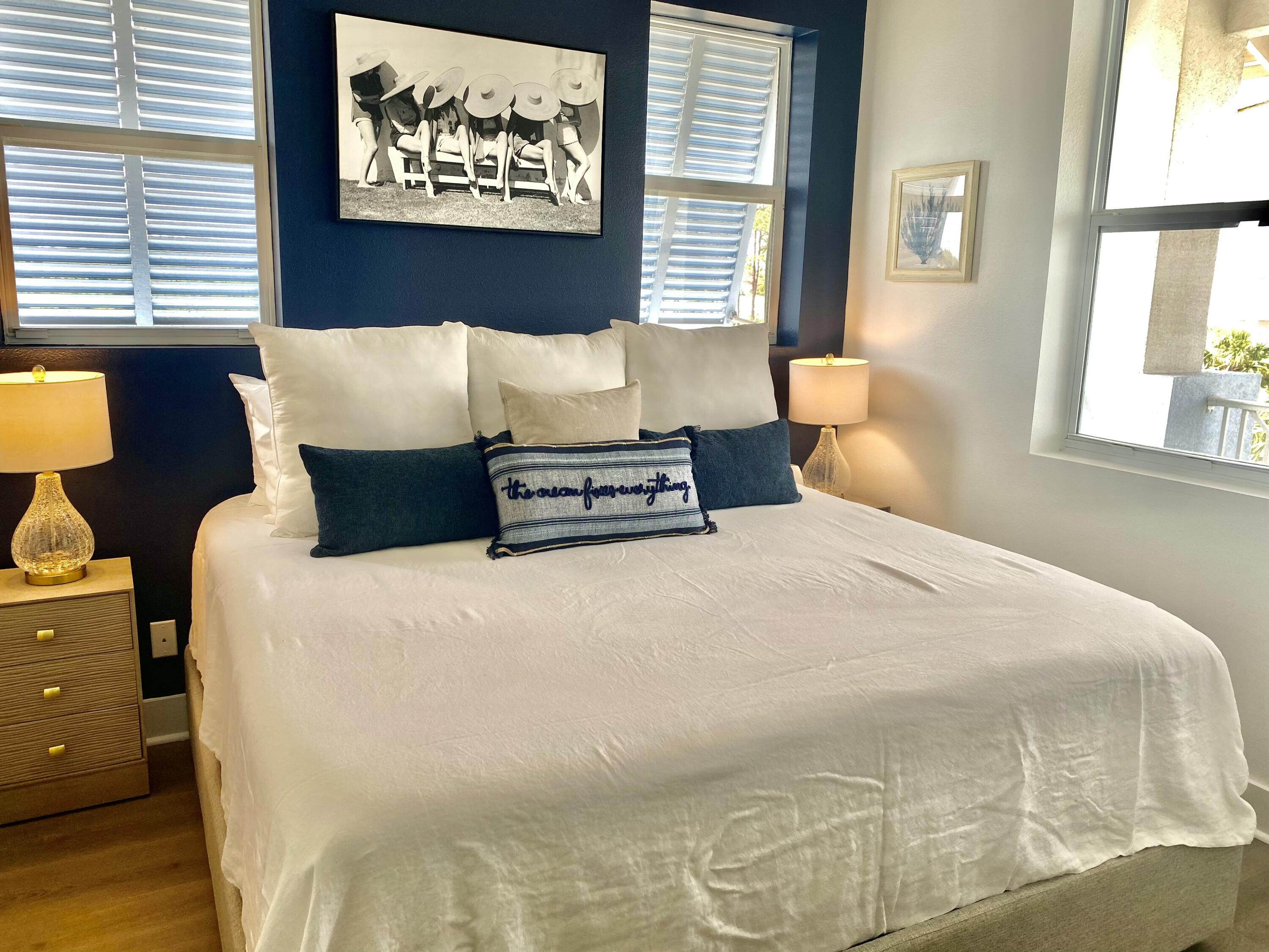 145 Spires Lane, Unit 411 Santa Rosa Beach, FL 32459 - Photo 20 of 44 a bedroom with a bed and a large window