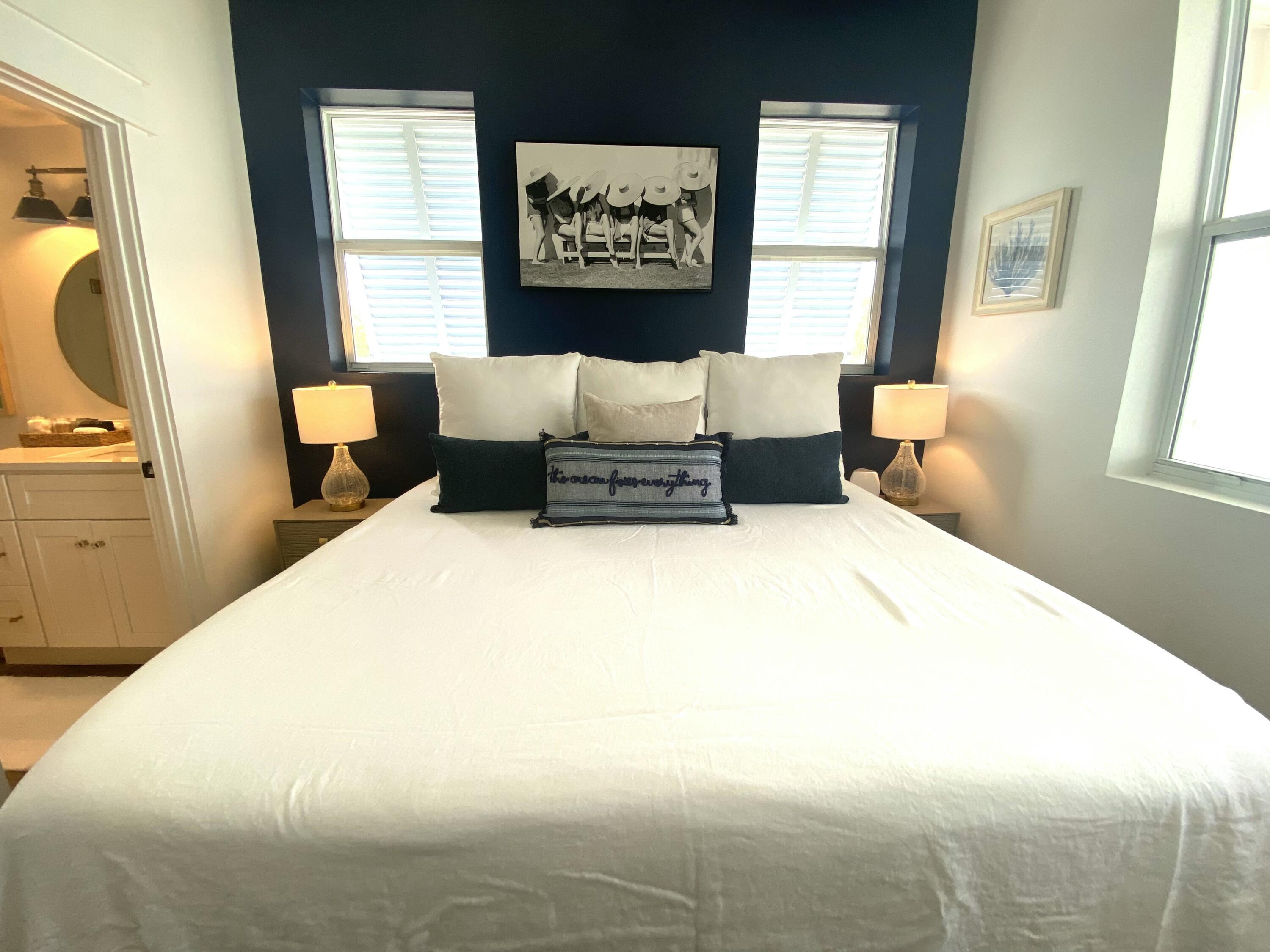 145 Spires Lane, Unit 411 Santa Rosa Beach, FL 32459 - Photo 23 of 44 a bed sitting in a bedroom next to a window