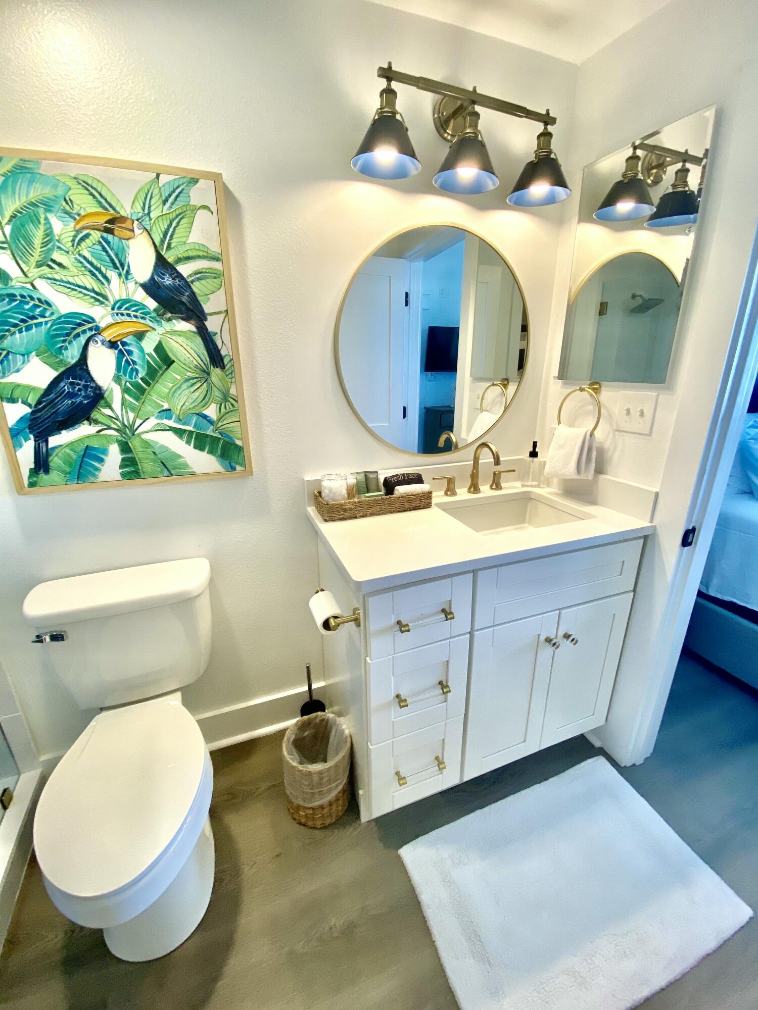 145 Spires Lane, Unit 411 Santa Rosa Beach, FL 32459 - Photo 26 of 44 a bathroom with a toilet sink and mirror