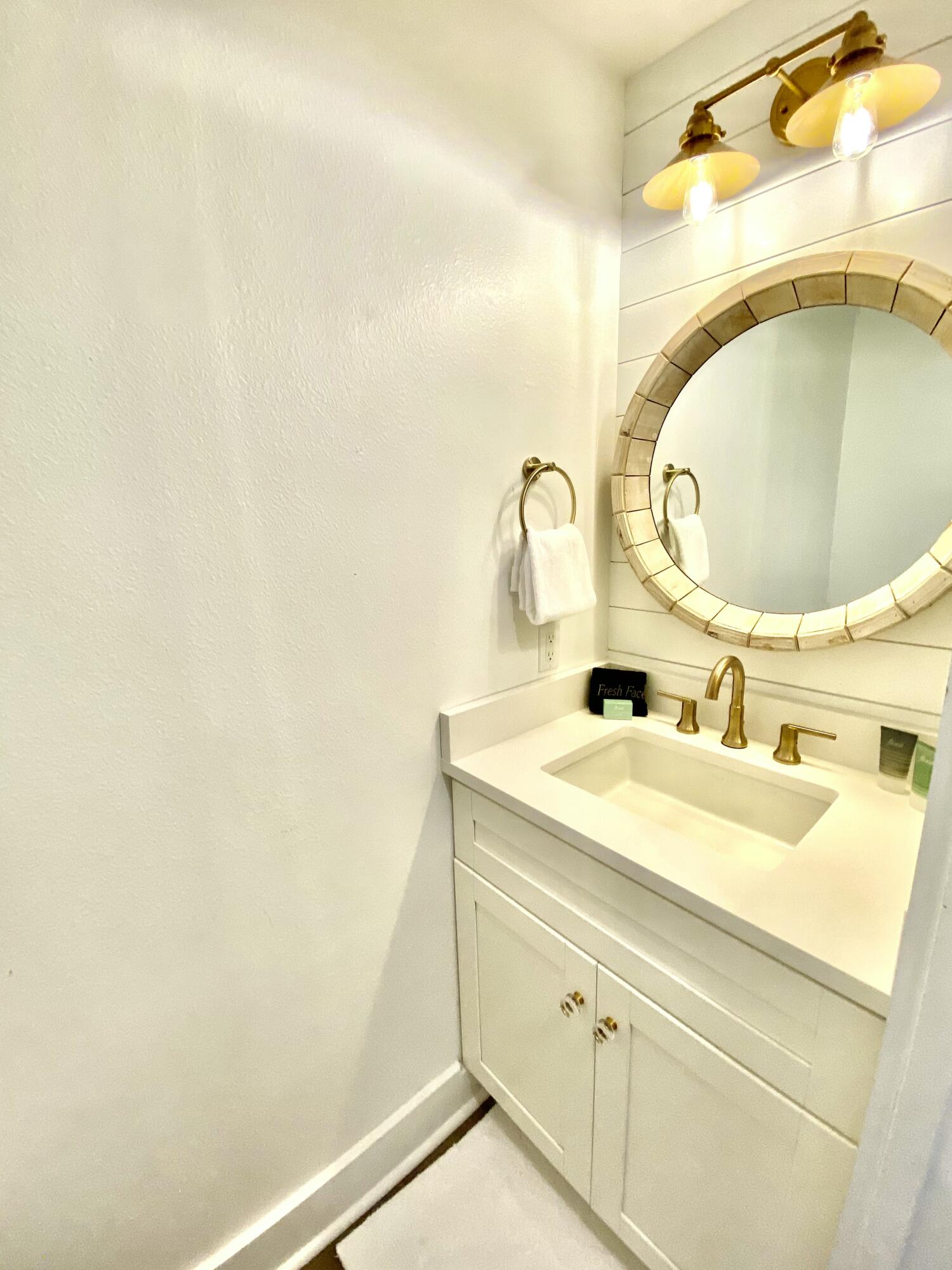 145 Spires Lane, Unit 411 Santa Rosa Beach, FL 32459 - Photo 31 of 44 a bathroom with a sink and a mirror