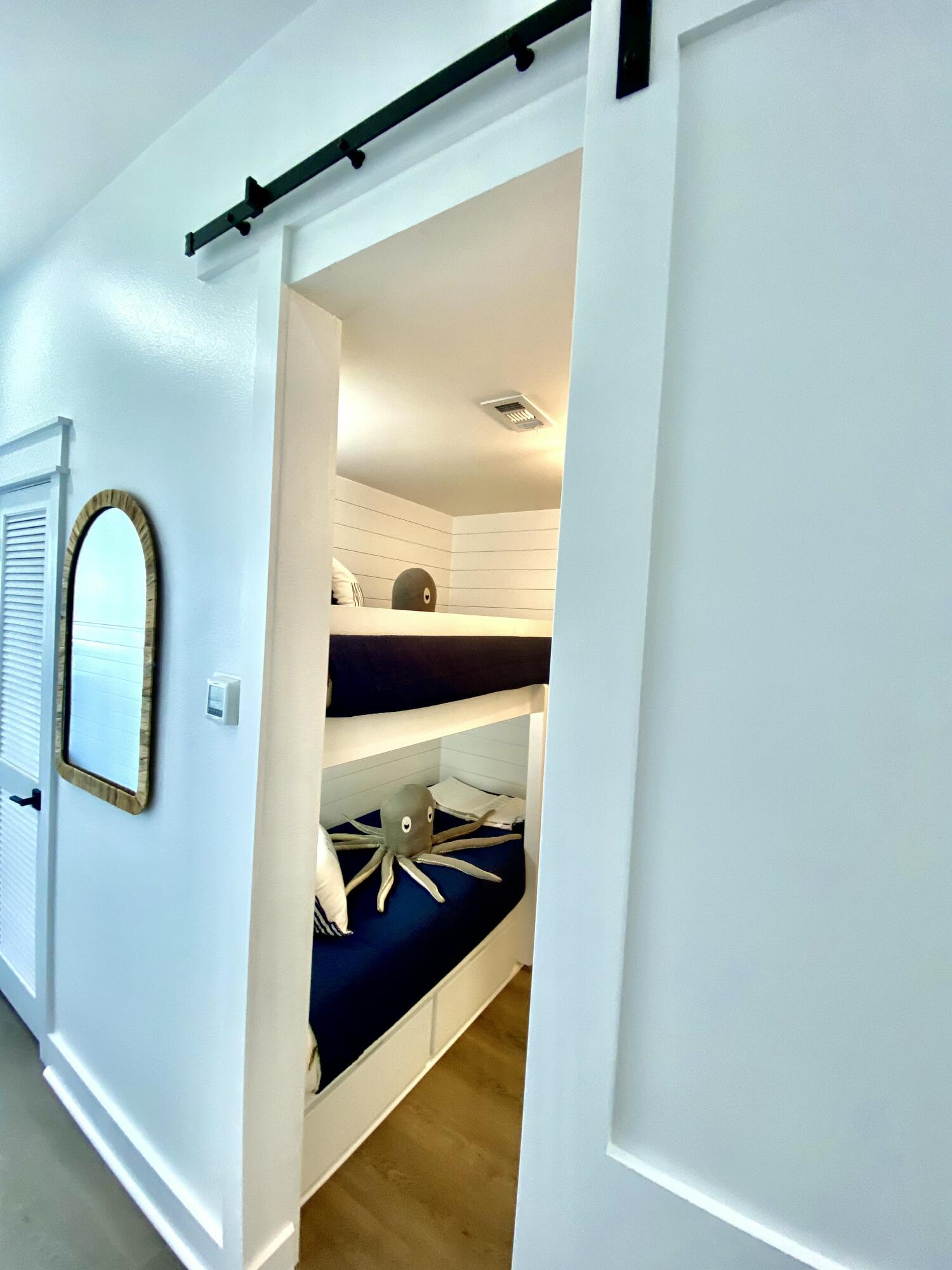 145 Spires Lane, Unit 411 Santa Rosa Beach, FL 32459 - Photo 34 of 44 a bathroom with a sink and mirror