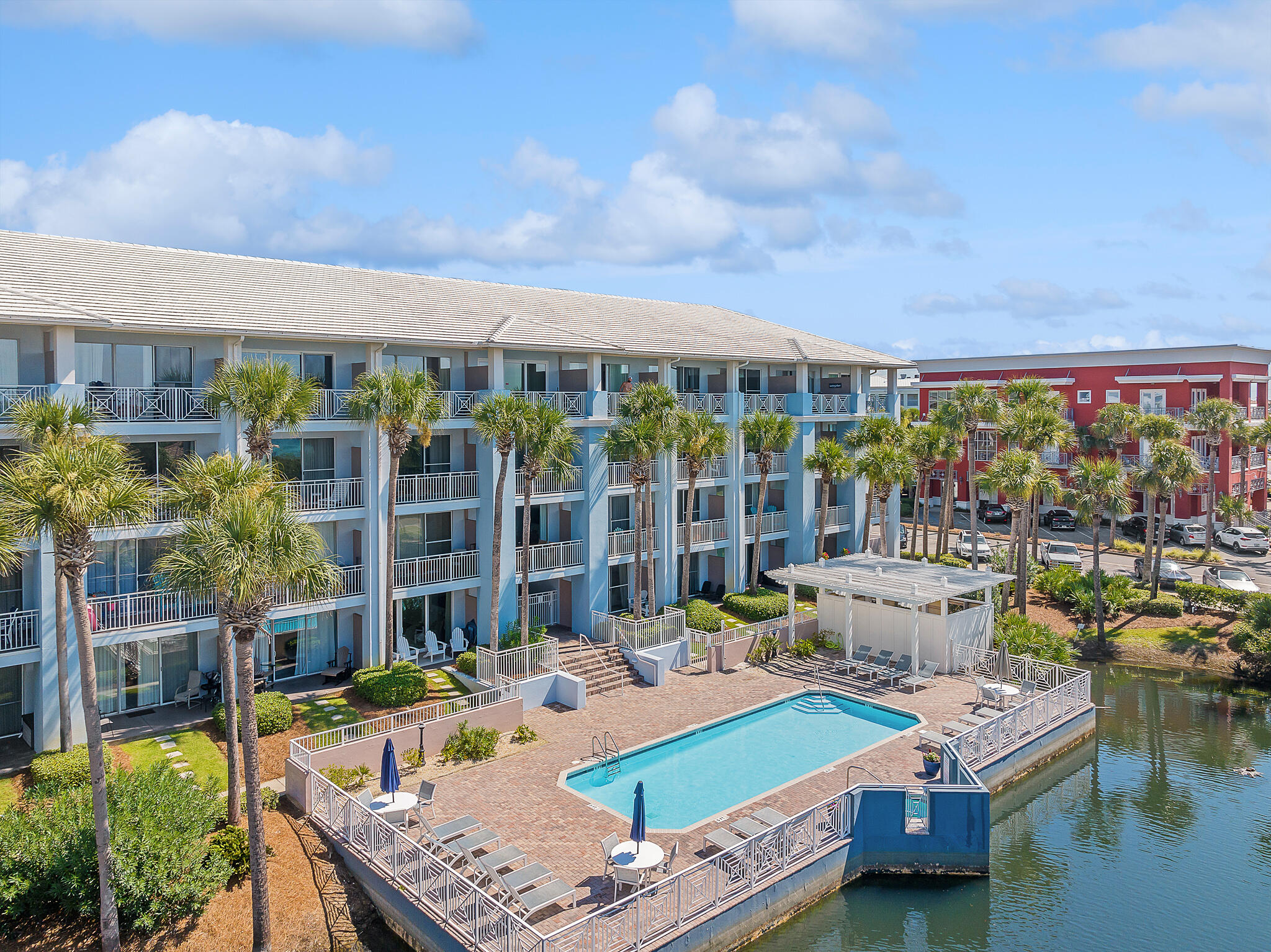 145 Spires Lane, Unit 411 Santa Rosa Beach, FL 32459 - Photo 38 of 44 a table and chairs sitting in front of a building